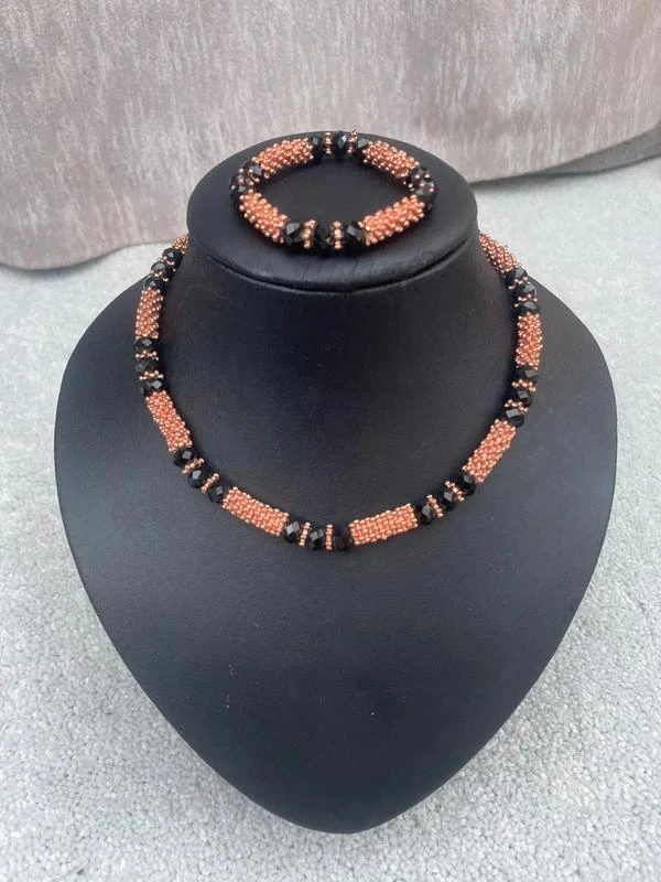 Ensemble collier et bracelet noir et bronze